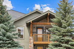 View of home's exterior with roof with shingles