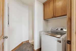Laundry Room with cabinet space, washer / dryer
