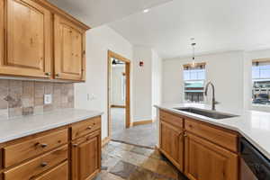 Kitchen featuring quartz countertops, tasteful backsplash, and stainless steel appliances