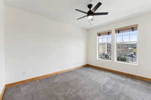 Master Bedroom featuring a ceiling fan, carpet, and lots of natural light