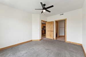 Master bedroom featuring a ceiling fan, and carpet flooring