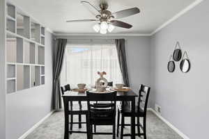 Dining space with carpet floors, ceiling fan, visible vents, and baseboards