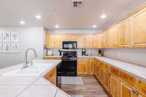 LVP flooring and fully stocked kitchen.