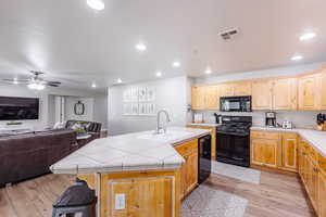 LVP flooring, fully stocked kitchen, with barstools, and large dinette set.