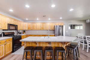 LVP flooring, fully stocked kitchen, with barstools, and large dinette set.