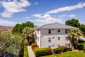 Exterior space of Building 10 located next to waterfall pool and family pool.