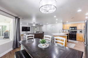 Large slider next to dinette set, seating for 7, and  LVP flooring.