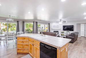 LVP flooring, fully stocked kitchen, with barstools, and large dinette set.