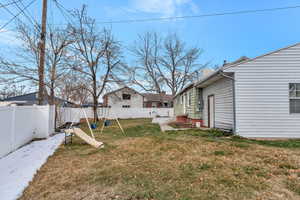 View of yard featuring a fenced backyard and a playground