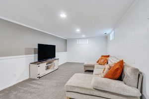 Living area featuring recessed lighting, visible vents, and light carpet