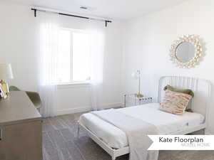 Bedroom with carpet floors, baseboards, visible vents, and multiple windows