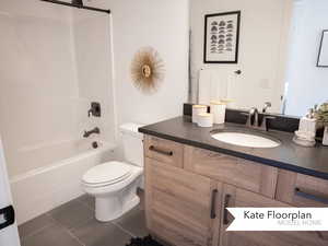 Full bathroom with vanity, tile patterned flooring, toilet, and  shower combination