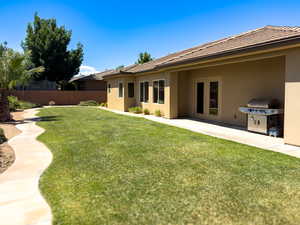 View of yard featuring french doors and a patio