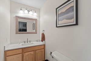 Bathroom featuring vanity and toilet
