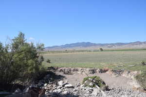 Property view of mountains with a rural view