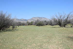 Property view of mountains with a rural view