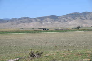 Property view of mountains with a rural view