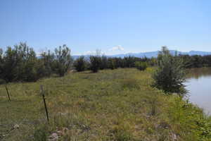 Mountain view featuring a water view