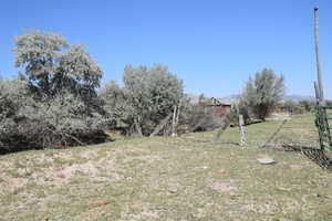 View of yard featuring fence