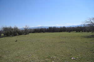 View of landscape with a rural view and a mountain view