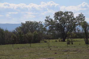 Exterior space with a rural view and fence