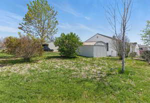 View of yard with an outbuilding