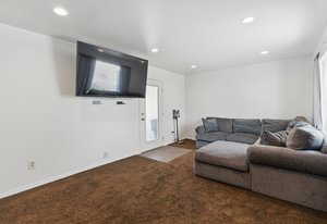 Living room with carpet flooring and recessed lighting