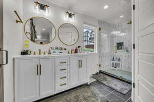 Master Bathroom featuring a sink, double vanity, a stall shower, recessed lighting, and tile patterned flooring