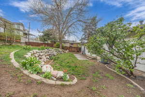 View of yard with fence