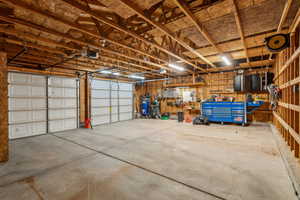 Garage featuring a garage door opener