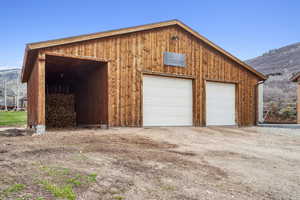 Detached garage featuring a mountain view