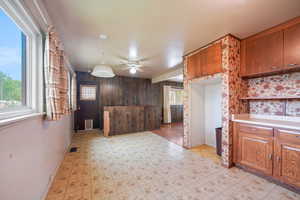 Kitchen featuring brown cabinets