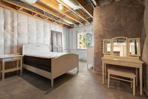 Bedroom with concrete floors