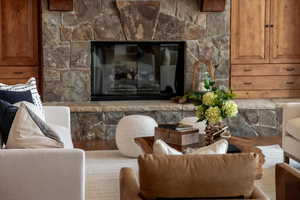 Living area with a stone fireplace