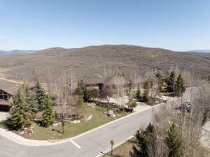 Birds eye view of property with a mountain view