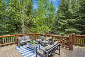 Wooden terrace with an outdoor living space