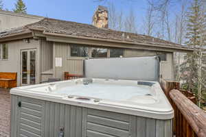Wooden terrace with a hot tub