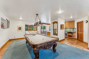 Rec room featuring light tile patterned floors, billiards, recessed lighting, and baseboards