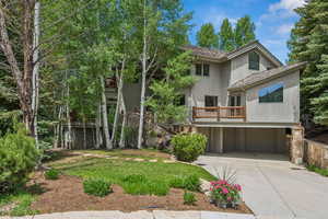 View of front of house with a garage and concrete driveway