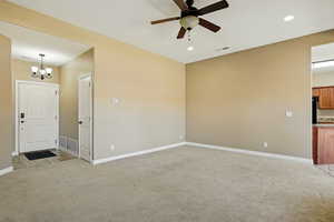 Interior space featuring visible vents, recessed lighting, and light colored carpet