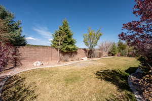 View of yard with a fenced backyard