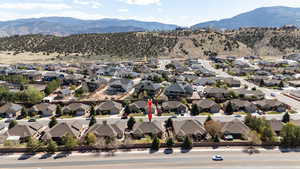Exterior space featuring a residential view and a mountain view
