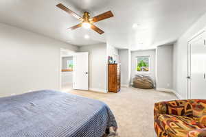 Bedroom featuring baseboards, ceiling fan, recessed lighting, and light colored carpet