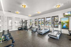 Workout area with baseboards and visible vents