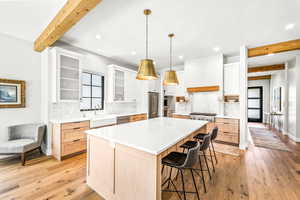 Kitchen featuring recessed lighting, a sink, and beam ceiling
