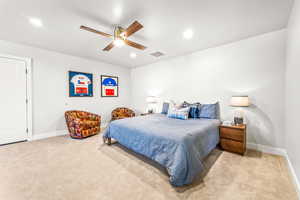 Carpeted bedroom with visible vents, a ceiling fan, baseboards, and recessed lighting