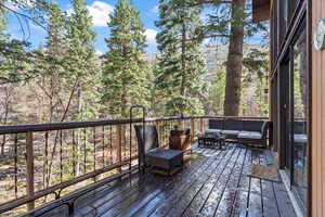 Wooden deck featuring an outdoor hangout area