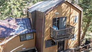 View of side of home with a balcony