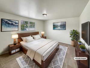Carpeted bedroom with baseboards