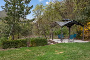 View of yard with a gazebo and a patio area